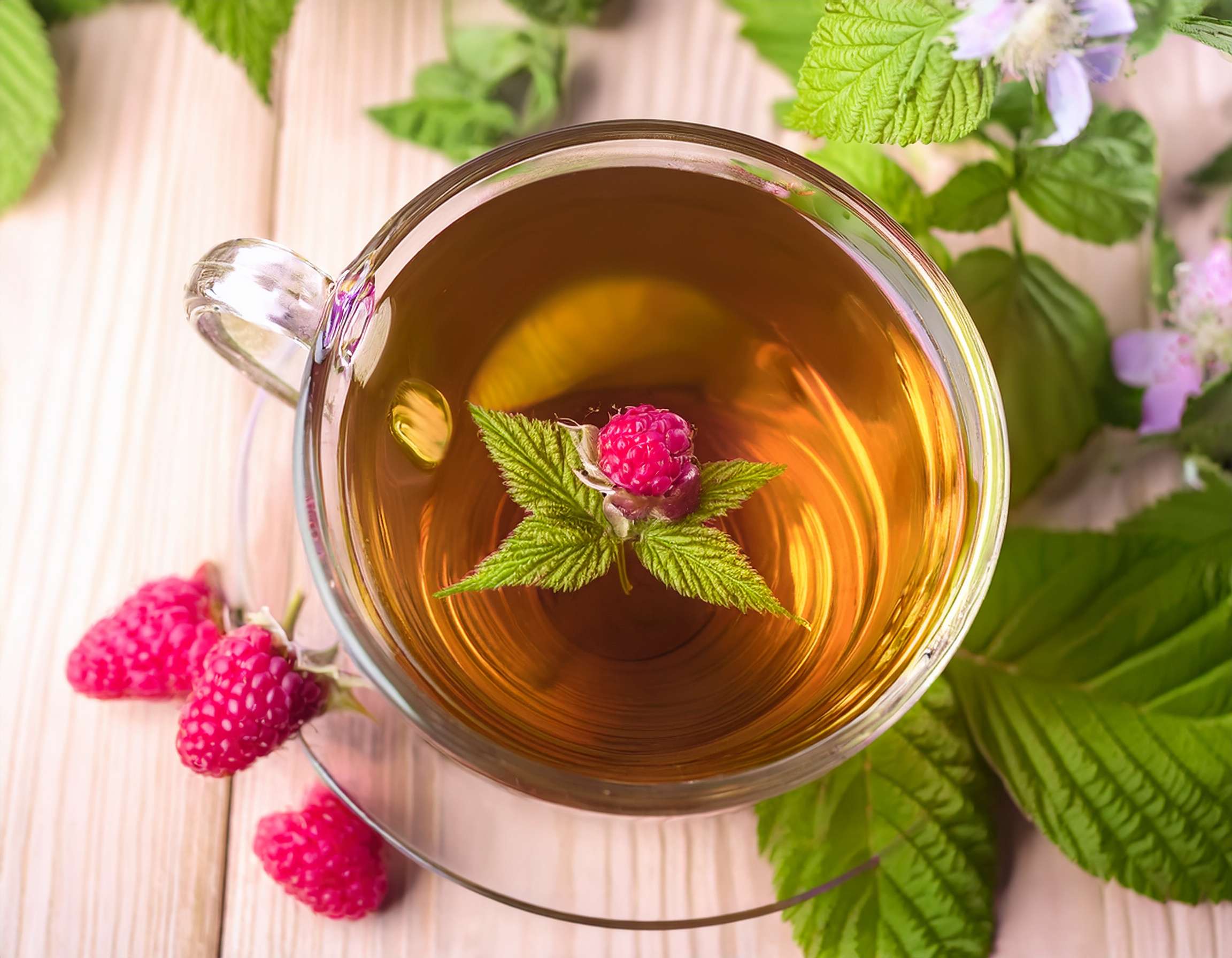 Firefly Create An Image Of Raspberry Leaf Herbal Tea With A Cup And Flowers 947574