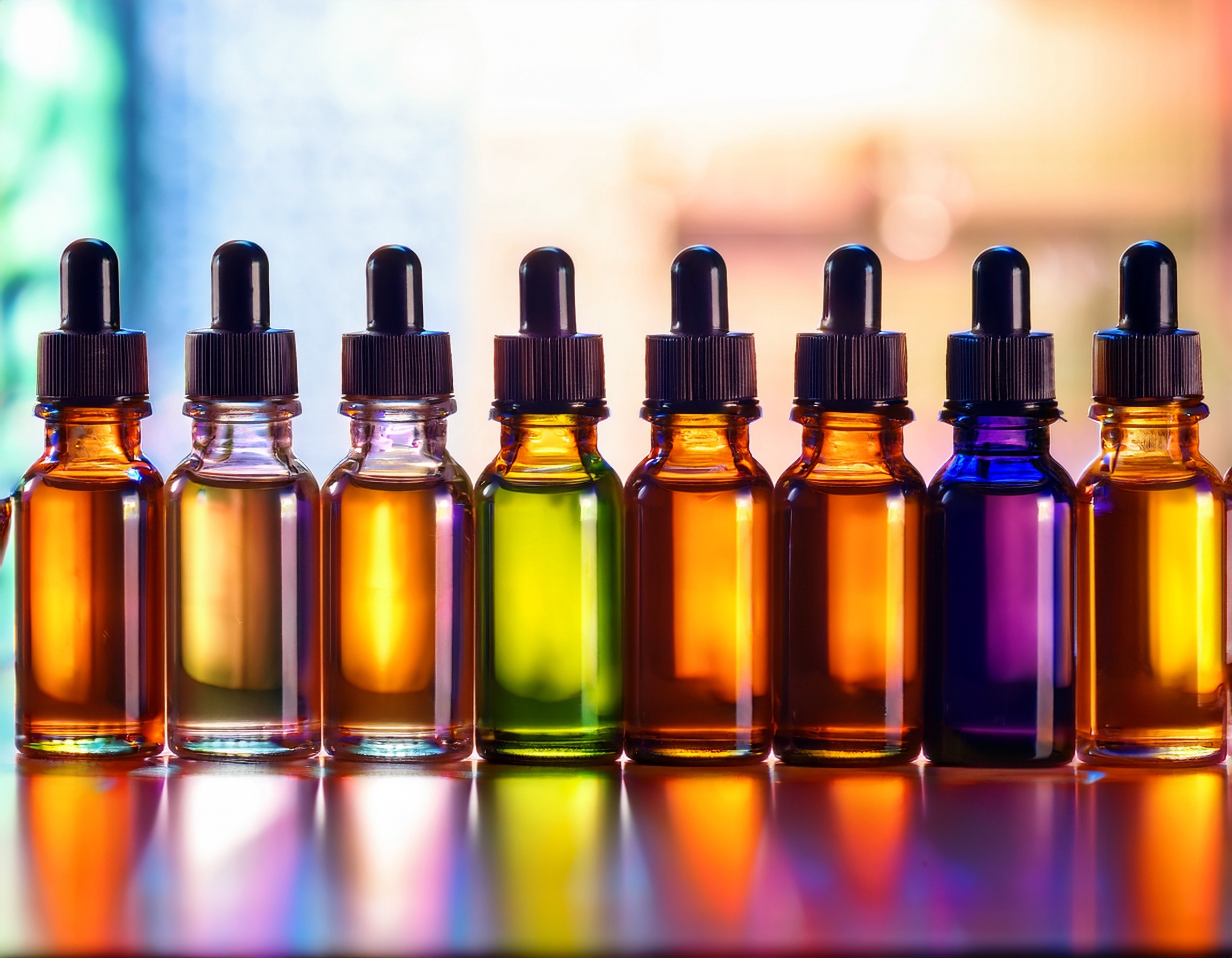 Firefly Generate An Image Of A Row Of Multicolored Amber Essential Oil Bottles 46902