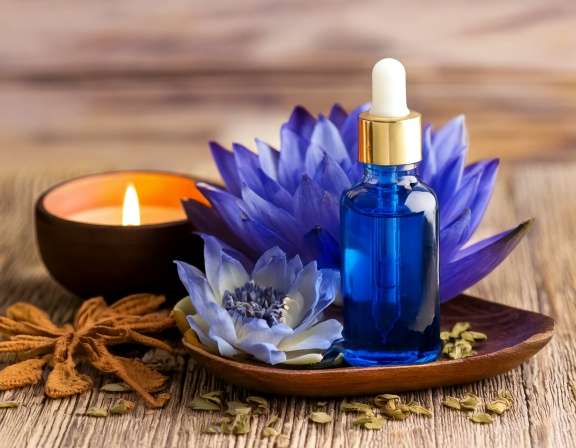 Firefly Generate An Image Of Blue Lotus Essential Oil With Candle And Dried Herb 110586