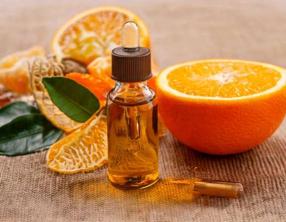 firefly generate an image of orange essential oil ; aromatherapy concept, cozy home and tranq 874529